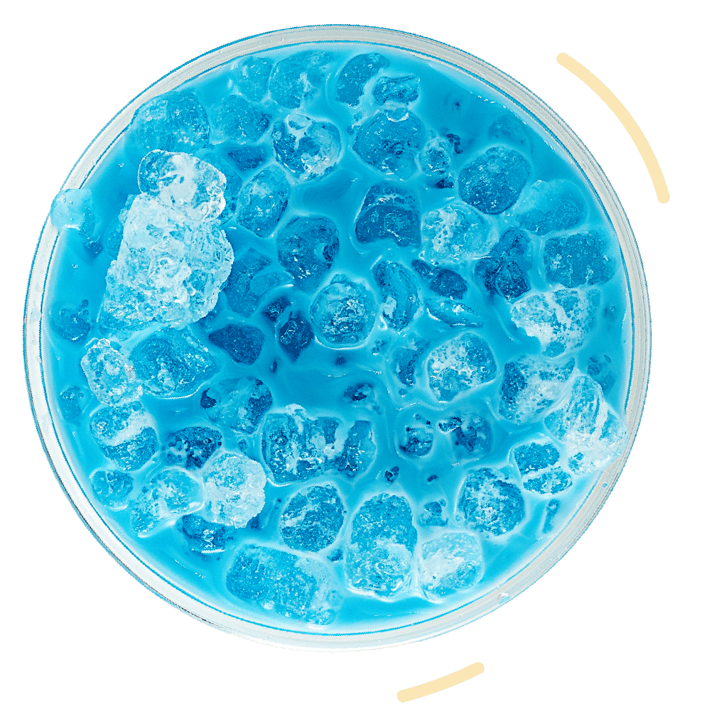 Bright blue soda with ice cubes in a clear glass, vintage soda fountain drink, refreshing summer beverage.