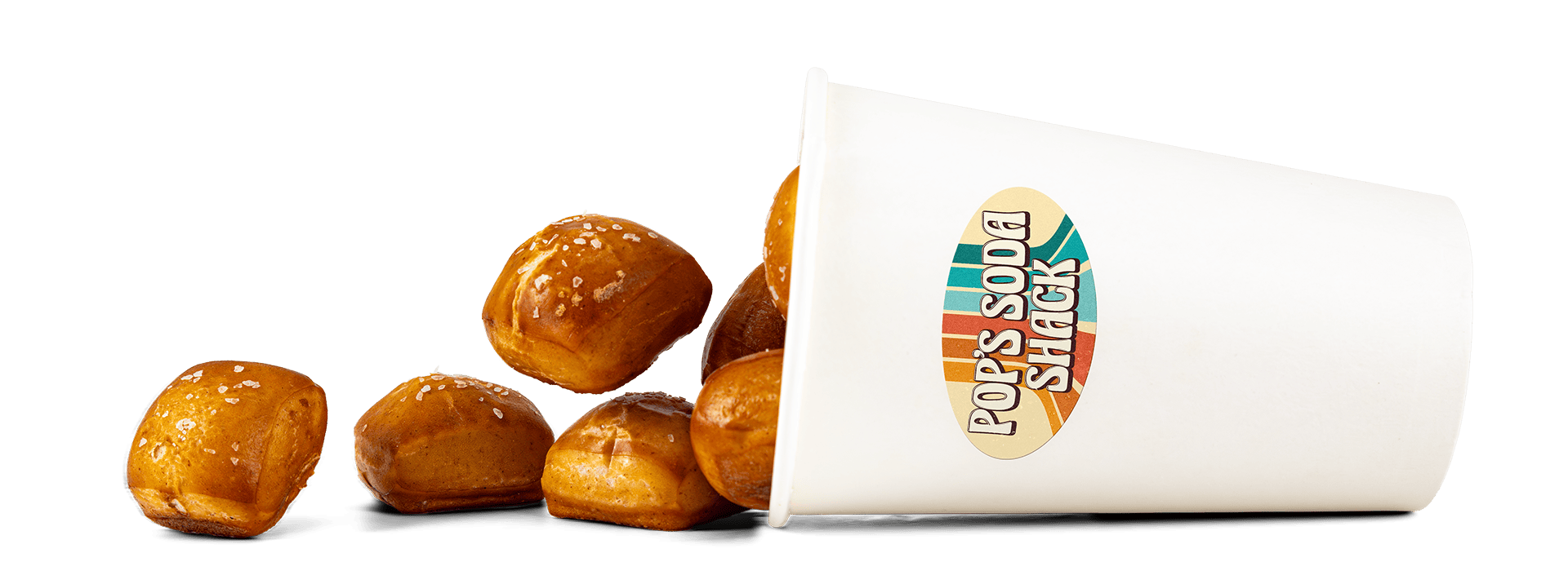 Butterscotch caramel popcorn spilling out of a Pop’s Soda Shack branded paper cup.